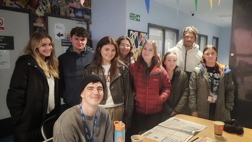 Group photo of students with clients from the Huggard Centre in Cardiff